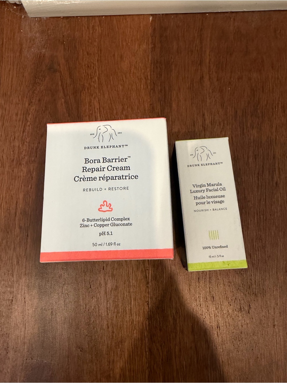 Drunk Elephant Bora Barrier Repair Cream — White with Coral Accents